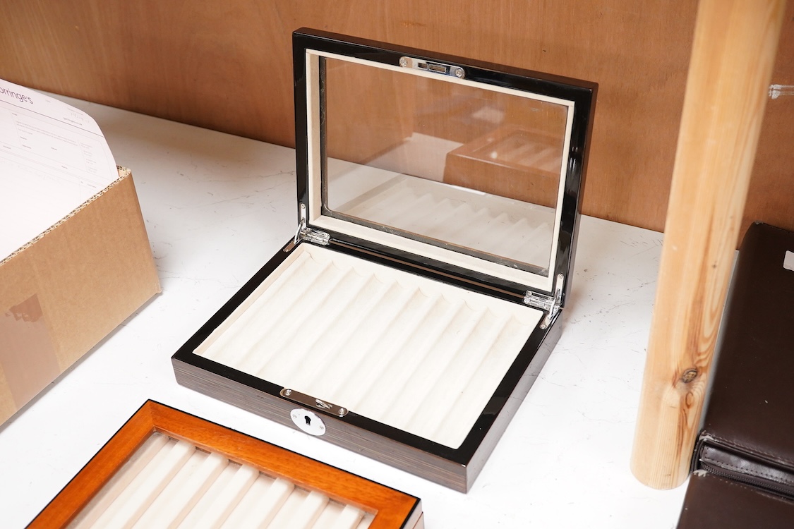 A pair of quality fountain pen desk top cabinets to hold ten and seven pens respectively